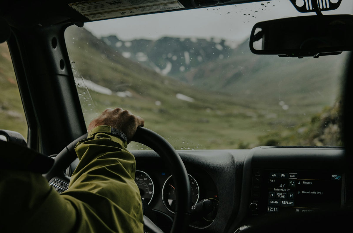 Driving on an open highway at sunset